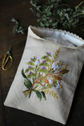 Hand embroidered linen bag with wildflower bouquet and lace trim